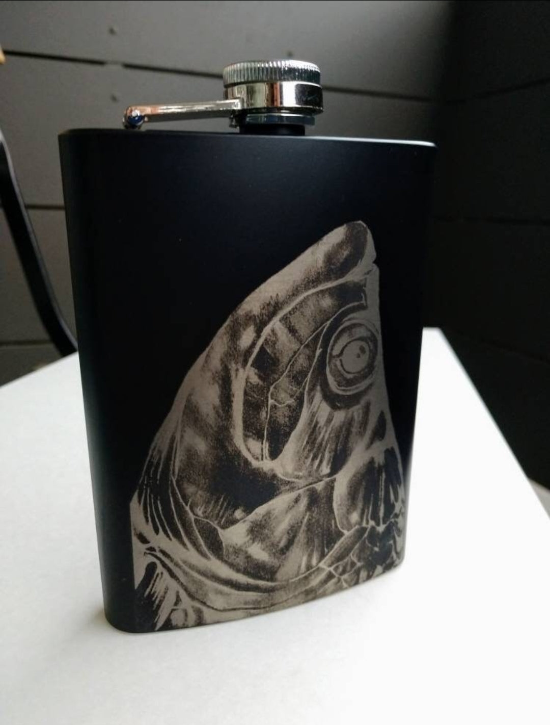 Metal beverage hip flask 8 oz. Black with Fish head themed image